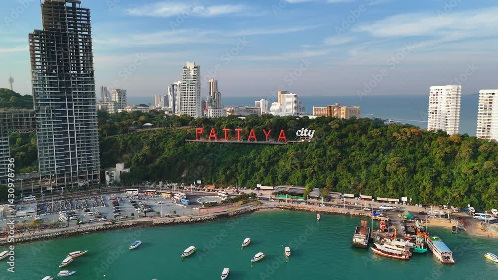 Pattaya City famous sign stands on coastal park hill slope