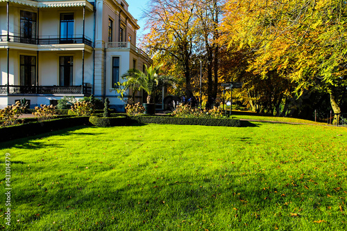 Scenic Autumn Garden with Grand Building