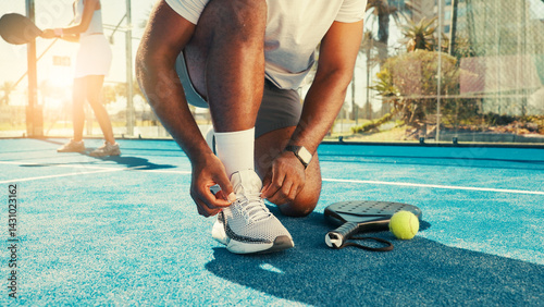 Man, hands and tie shoes for tennis with start, safety and regulation sneakers on court. Padel player, feet and outdoor on turf for tournament, fitness challenge and ready for sports competition