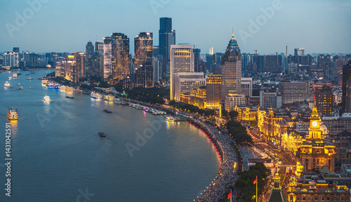 Tablou pe pânză Aerial view of Shanghai illuminated skyline and river at night.