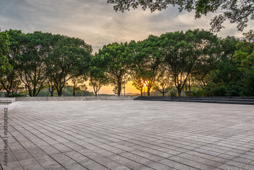 Tranquil Urban Park at Sunset Surrounded by Lush Trees