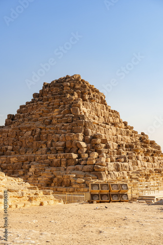 Unique pyramid structure in an ancient archaeological site under a clear sky during daylight hours