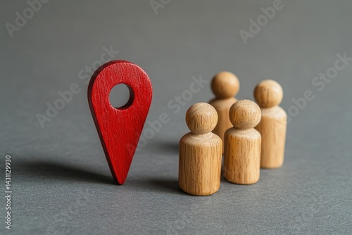 A red location marker and a group of wooden figures