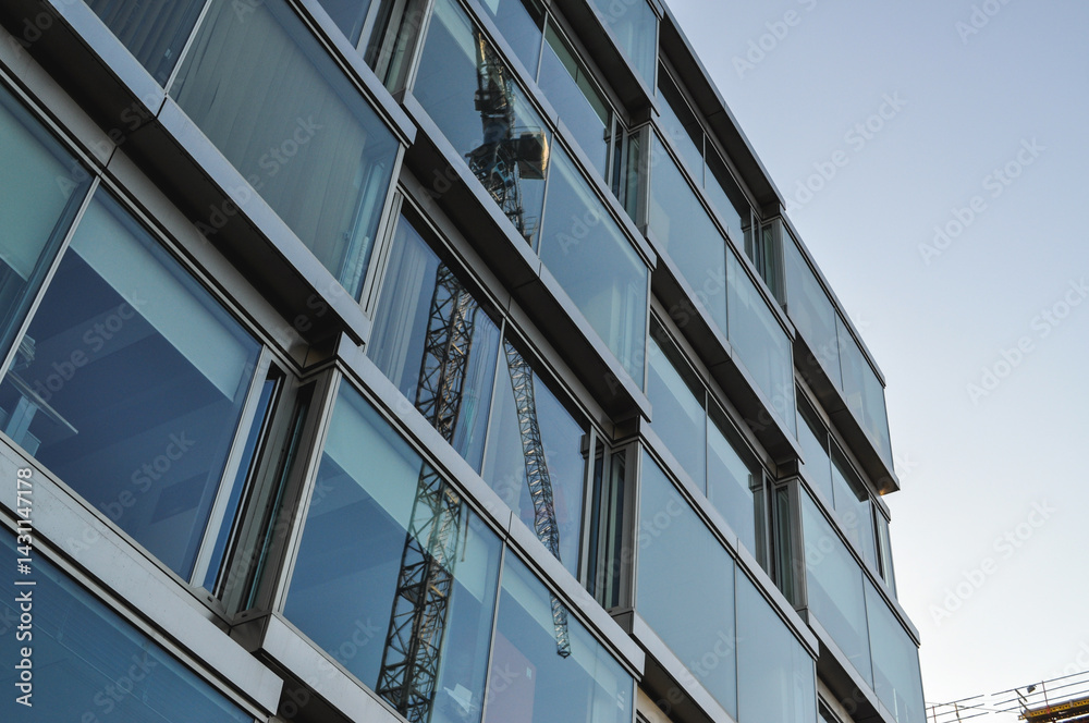 glass office building blue architecture office district crane machine