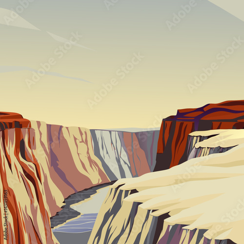 A dramatic canyon landscape with deep red rock formations, a river at the bottom, and a clear blue sky.