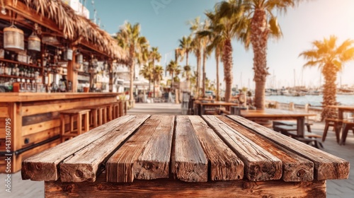 Rustic wooden table at tropical beach bar with palm trees and marina view creating a serene vacation atmosphere perfect for summer travel and relaxation