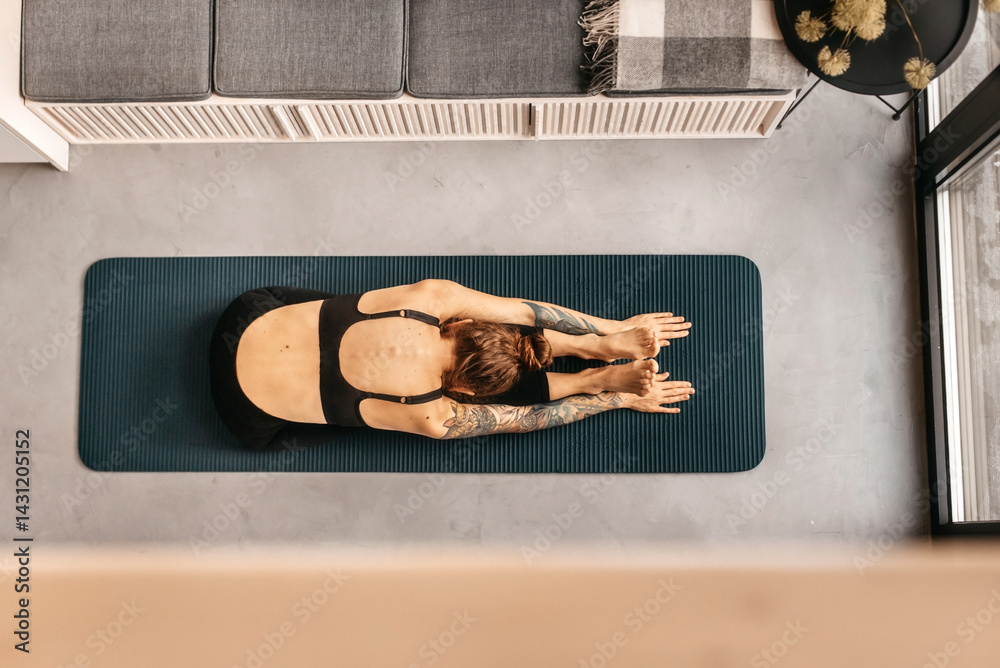 Woman Practicing Yoga and Stretching at Home