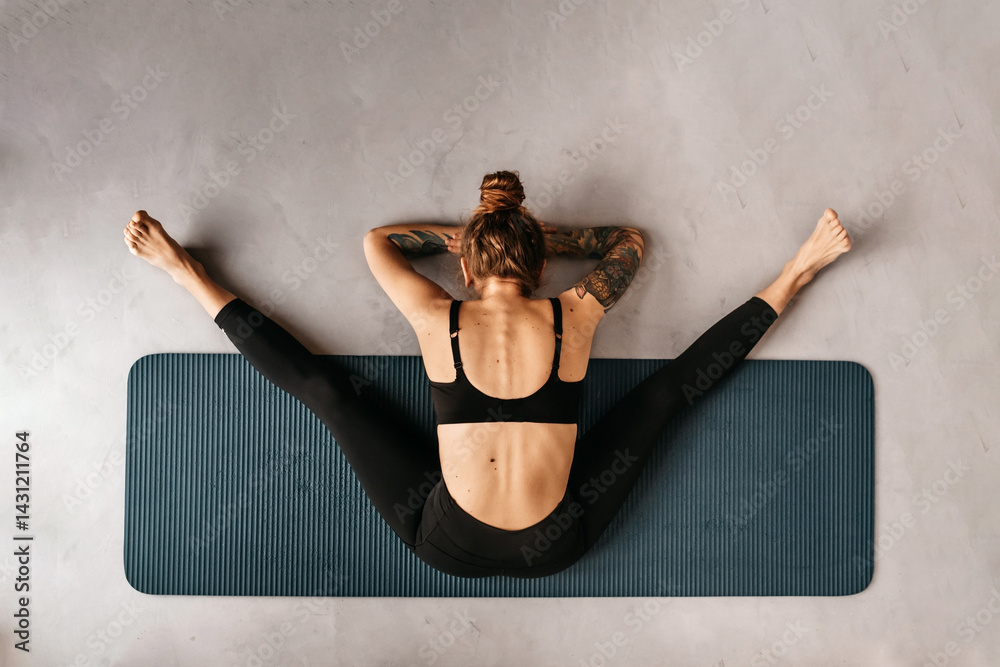 Woman Doing Yoga Exercise on Mat Top View