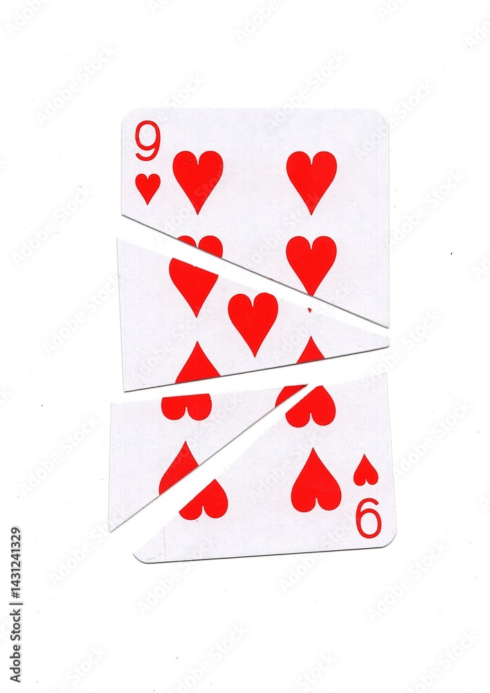 A playing card in the suit of hearts cut into sharp pieces. A playing card in the suit of hearts cut into sharp pieces.