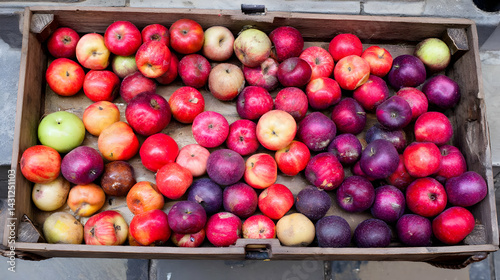crate of heirloom apples with NFC tags that tell their origin story when scanned.