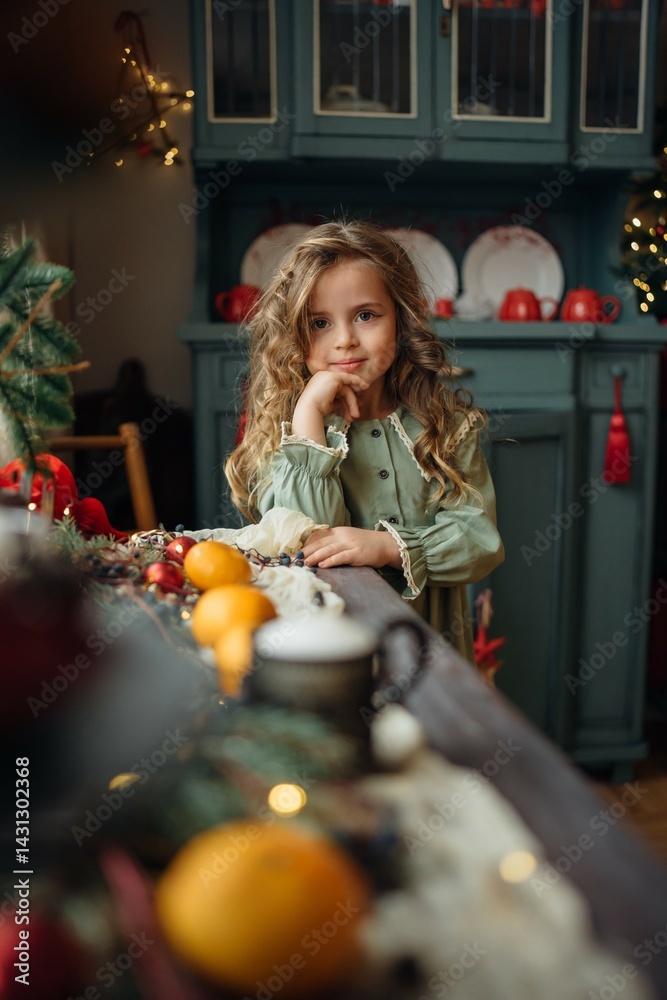 little beautiful girl at the festive New Year's table. family traditions.
