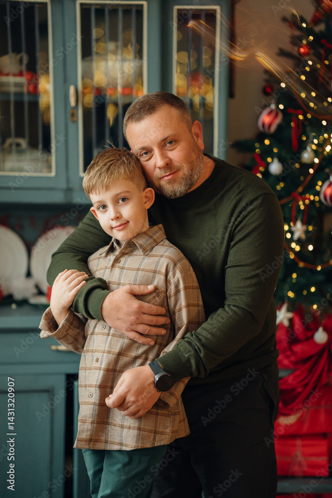 dad and little son at the Christmas tree.