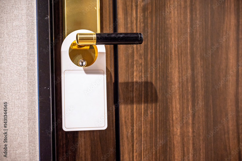  Empty blank white sign tag door on hanger the hotel room electronic card key door lock with Wooden oak door background