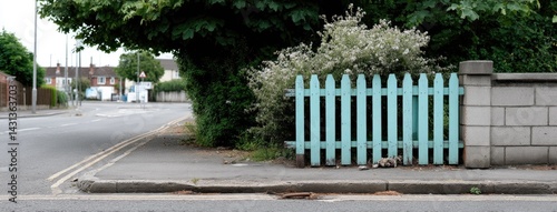 Obraz na płótnie A blue fence stands elegantly next to green cypress trees and decorative pots, enhancing the garden's tranquility and charm w salonie