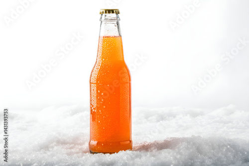 A brown glass beer bottle with water drops sits isolated amongst cool ice, a refreshing beverage.