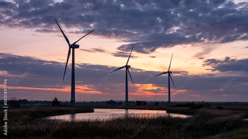 Obraz premium Wind turbines catch the last rays of the sun!
