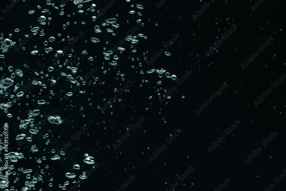 Obraz premium Many water bubbles on black background, closeup. Space for text