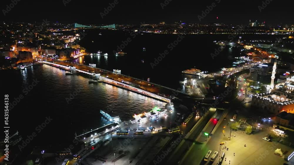Aerial half-circle above Galata Bridge and Istanbul's illuminated coast Aerial half-circle above Galata Bridge and Istanbul's illuminated coast