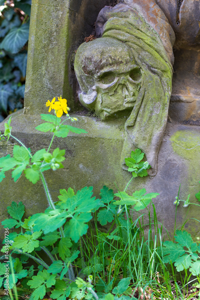 Historic Statue on the spring mystery old Prague Cemetery, Czech Republic