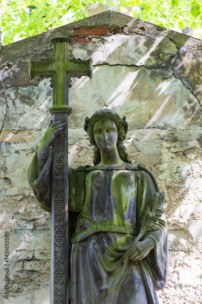 Historic Statue on the spring mystery old Prague Cemetery, Czech Republic