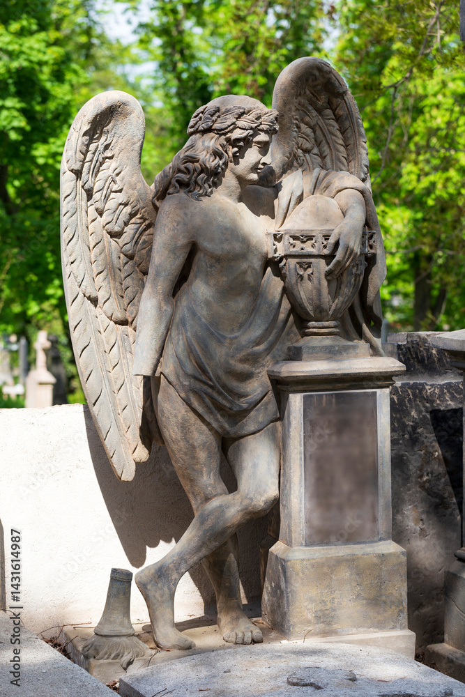 Historic Statue on the spring mystery old Prague Cemetery, Czech Republic