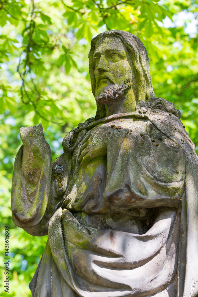 Historic Statue on the spring mystery old Prague Cemetery, Czech Republic