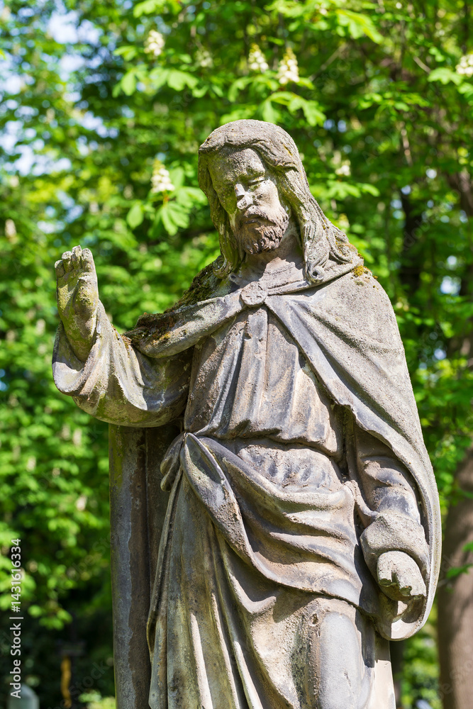 Historic Statue on the spring mystery old Prague Cemetery, Czech Republic