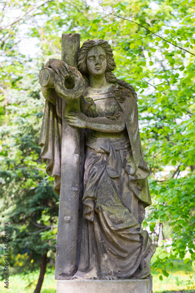 Historic Statue on the spring mystery old Prague Cemetery, Czech Republic