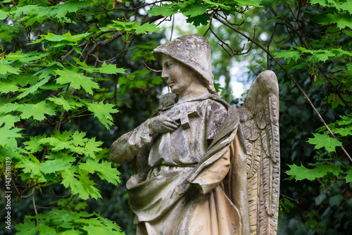 Obraz na płótnie Historic Statue on the spring mystery old Prague Cemetery, Czech Republic w salonie