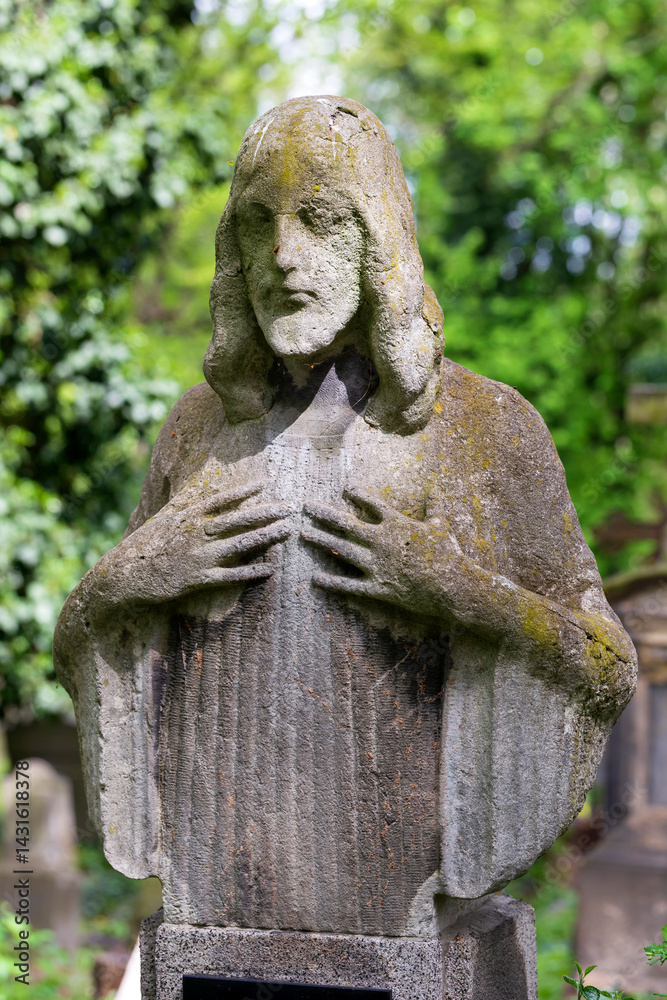 Historic Statue on the spring mystery old Prague Cemetery, Czech Republic