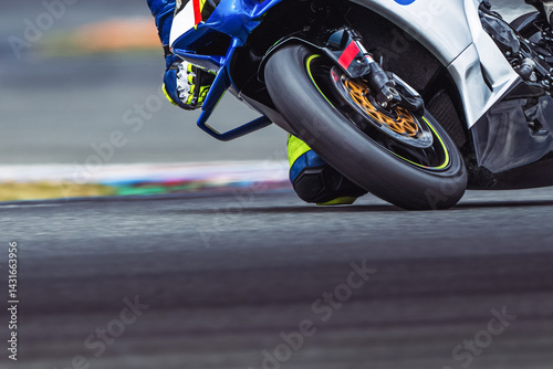 Road motorcycle racing, front wheel close up detail. Speed, circuit