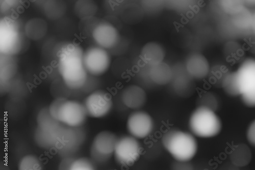 Abstract monochrome bokeh lights background with blurred circular shapes