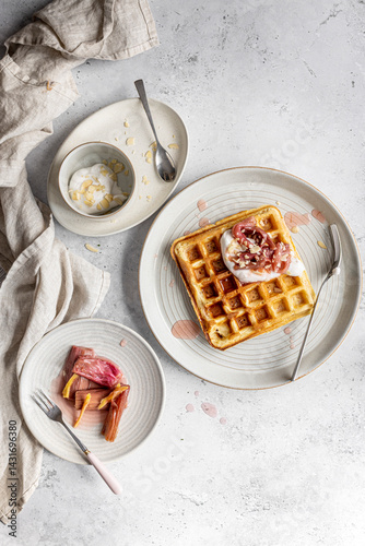 Waffles with baked rhubarb, coconut yoghurt and flaked almonds