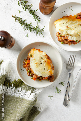 Plates of Shepherd's Pie on a Light Background With Green Cloth