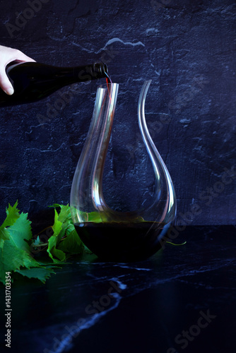 Decanting red wine concept with swan style decanter that is suitable for bold wine such as shiraz cabernet shown.
