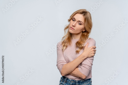Upset confused bad emotional and thinking Caucasian woman. Unhappy stressed female. Young lady standing feeling depressed dramatic scene looking at camera on isolated background. photo