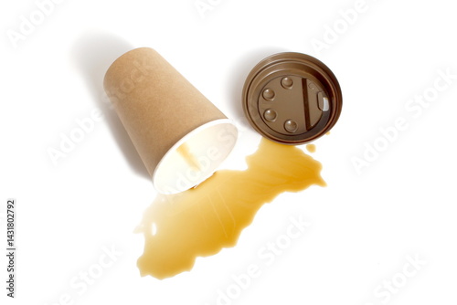 Spilled coffee residue with paper cup lies on white background.	