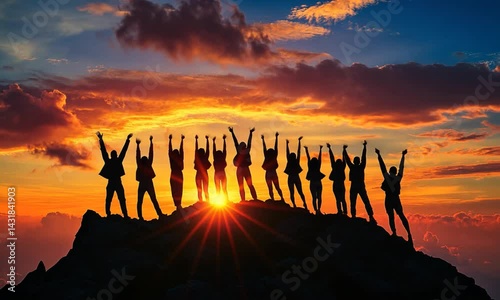 Group of people celebrating on a mountain peak during a vibrant sunset, with dramatic clouds