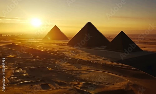 Majestic Pyramids of Giza at Sunset with Desert Landscape and City Skyline in Background