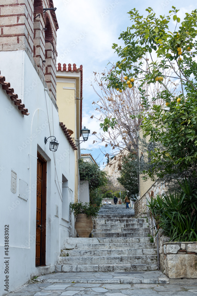 Φωτογραφία Steps in a narrow alley rise to a hill with ruins