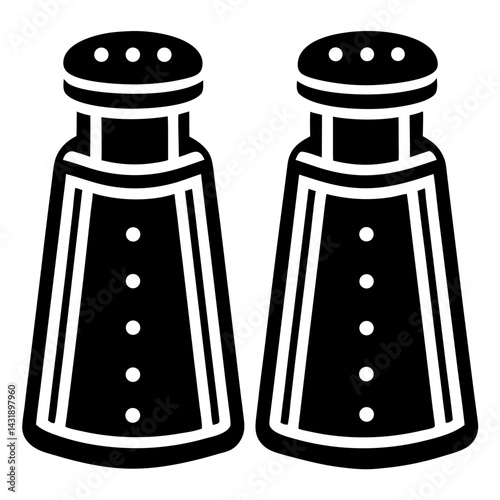 Two glass salt and pepper shakers with seasoning for food preparation