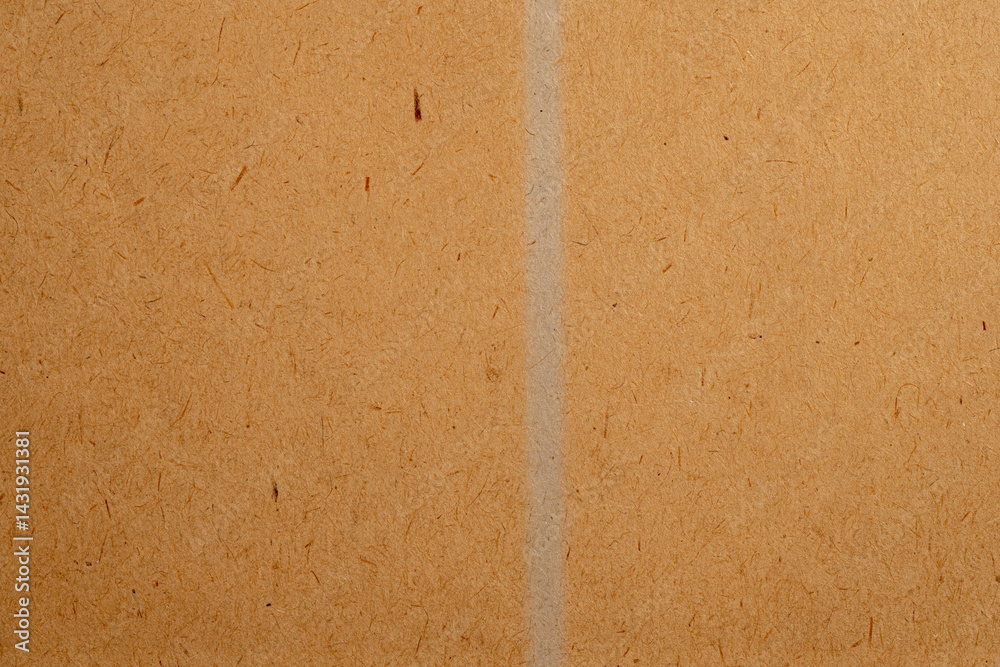 Fototapeta premium Brown recycled paper texture with vertical fold 