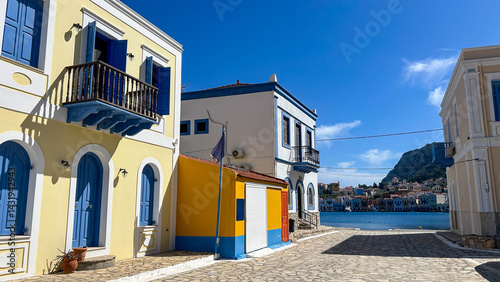 Fotografie Colorful Traditional Houses With Blue Doors And Shutters Facing The Sea On Kaste