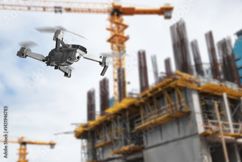 Drone with camera flying near unfinished building. Unmanned aerial vehicle for surveillance
