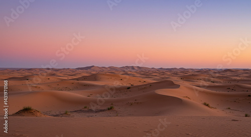 Serene Desert Landscape at Twilight with Rolling Sand Dunes and Colorful Sky