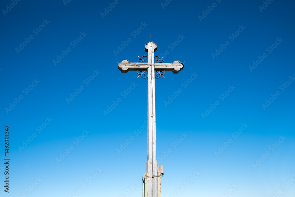 wooden mountain cross against blue sky background wooden mountain cross against blue sky background