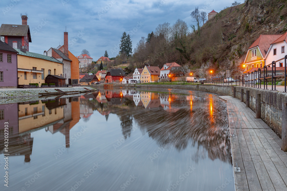 View of historic buildings and riverfront along the Vltava River in Cesky Krumlov, Czech Republic