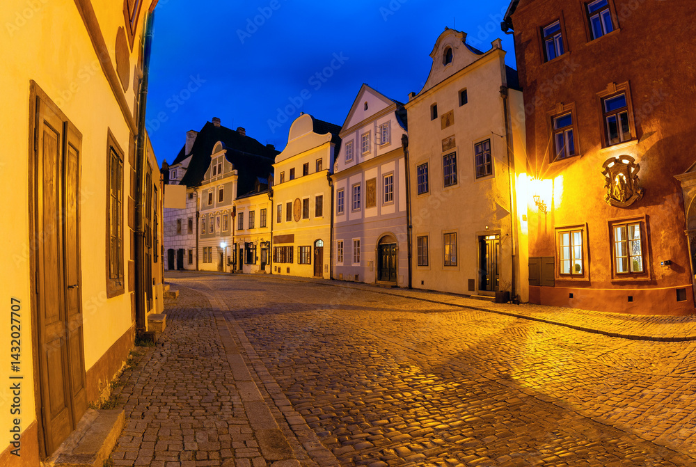 Evening view of a cobbled street with historic buildings in Cesky Krumlov, Czech Republic