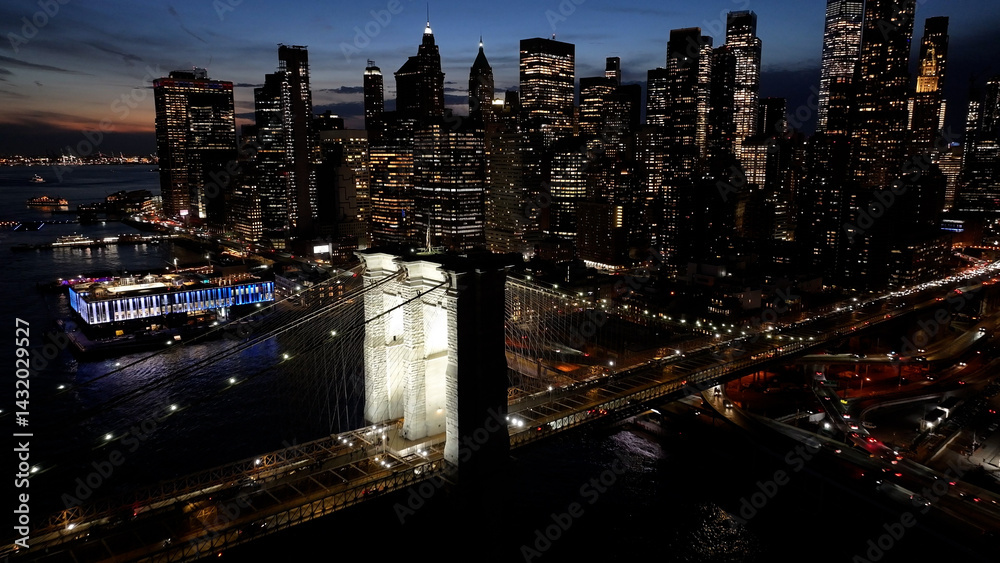 Fototapeta premium Night Scape Of Brooklyn Bridge At Manhattan In New York United States. City At Night Scene. Illuminated Bridge Landscape. Brooklyn Bridge At New York United States. Highrise Buildings. 