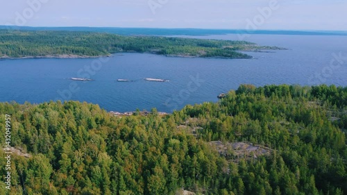 Wallpaper Mural Russia, Lake Ladoga, Koyonsaari. View of the coast of the island in a cold lake. Beautiful nature of the Republic of Karelia. Panoramic view from the height of the Ladoga skerry islands. 4K Torontodigital.ca